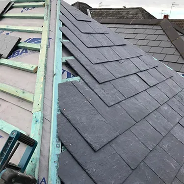 the roof of a house is being repaired