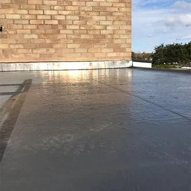 a skateboarder doing a trick on a flat surface