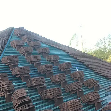 the roof of a house with a lot of brown tiles on it